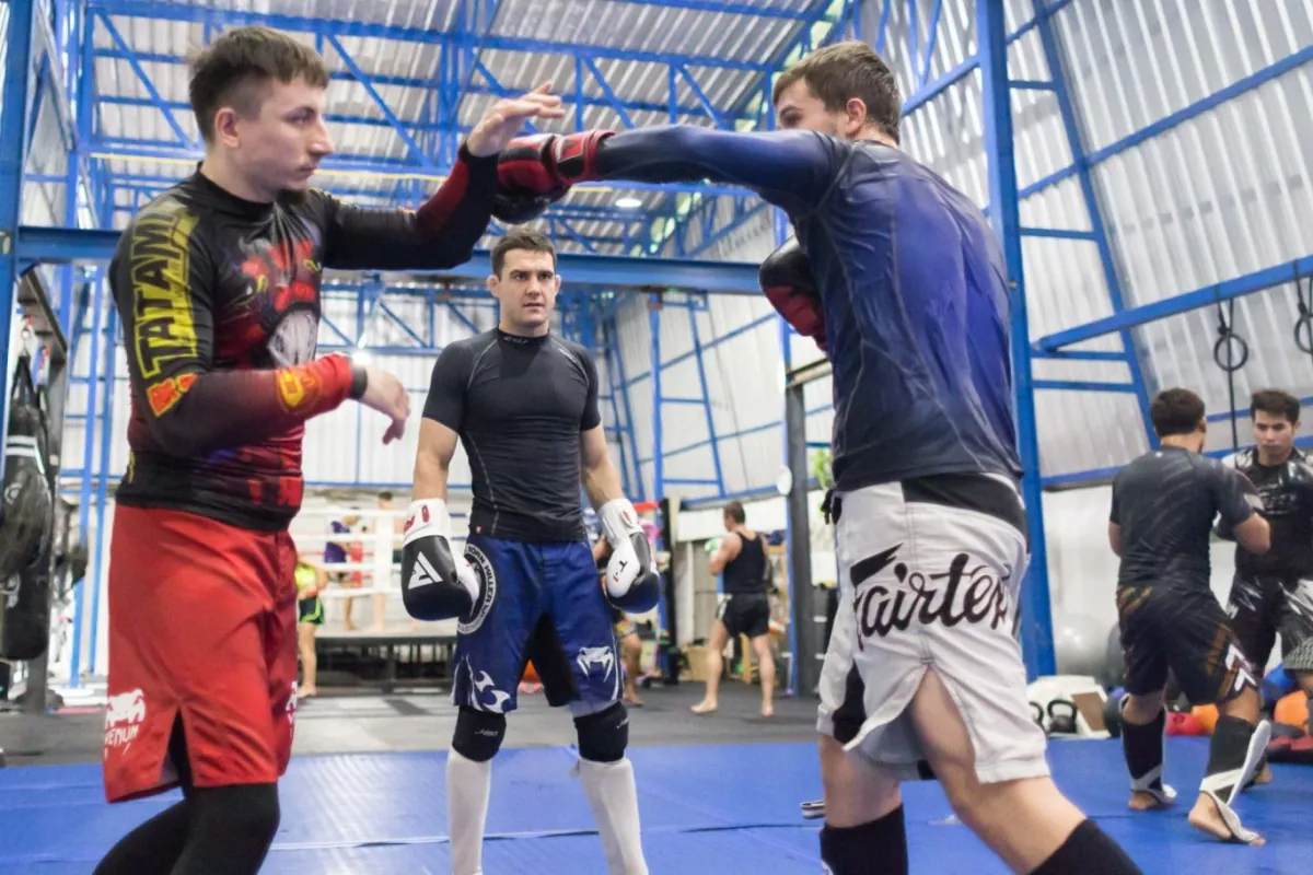 A coached drill on the mats at Bangkok Fight Lab